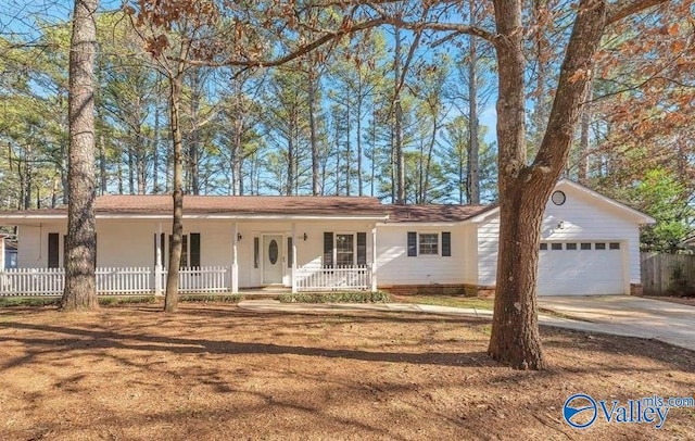 single story home with covered porch and a garage