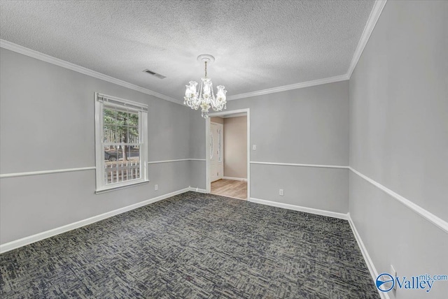 unfurnished room with crown molding, carpet floors, a textured ceiling, and a notable chandelier