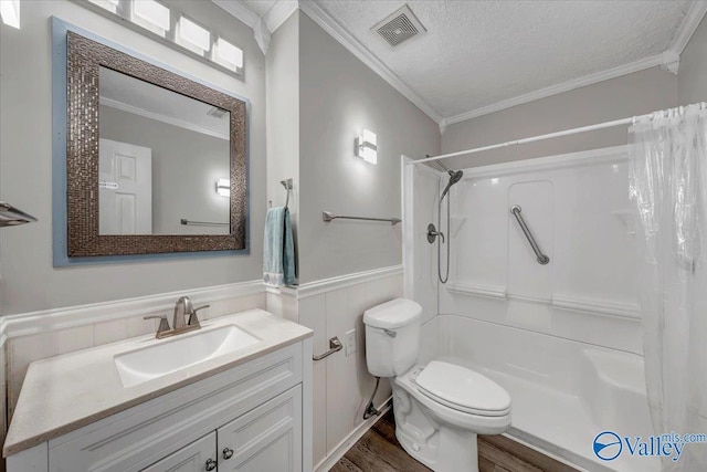 bathroom featuring curtained shower, a textured ceiling, and ornamental molding