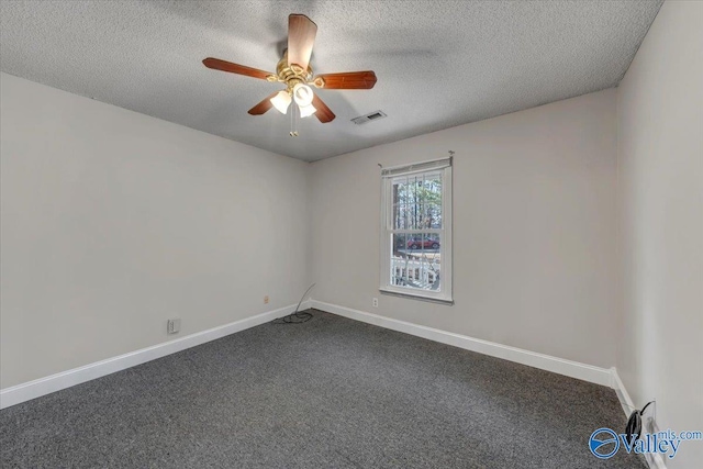 carpeted spare room featuring a textured ceiling and ceiling fan