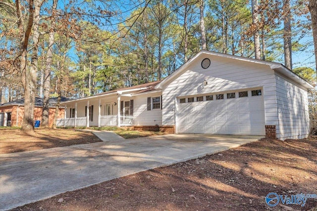 ranch-style home featuring a porch and a garage