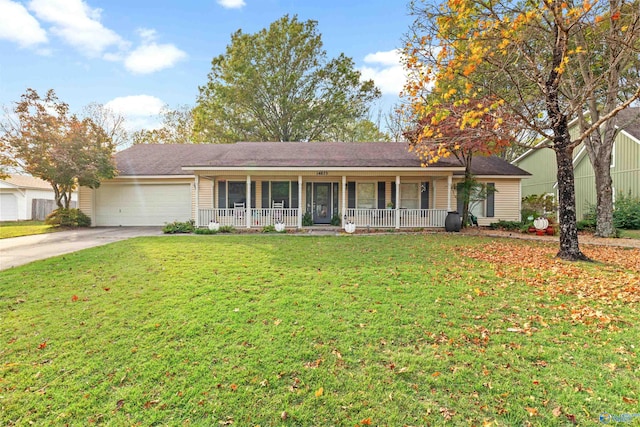 ranch-style home with a front lawn, a garage, and a porch