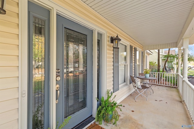 doorway to property featuring a porch