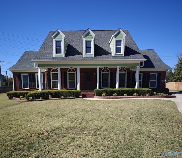 140 Fox Hollow Dr, Madison, AL 35758 - cape cod house featuring a porch, a shingled roof, and brick siding