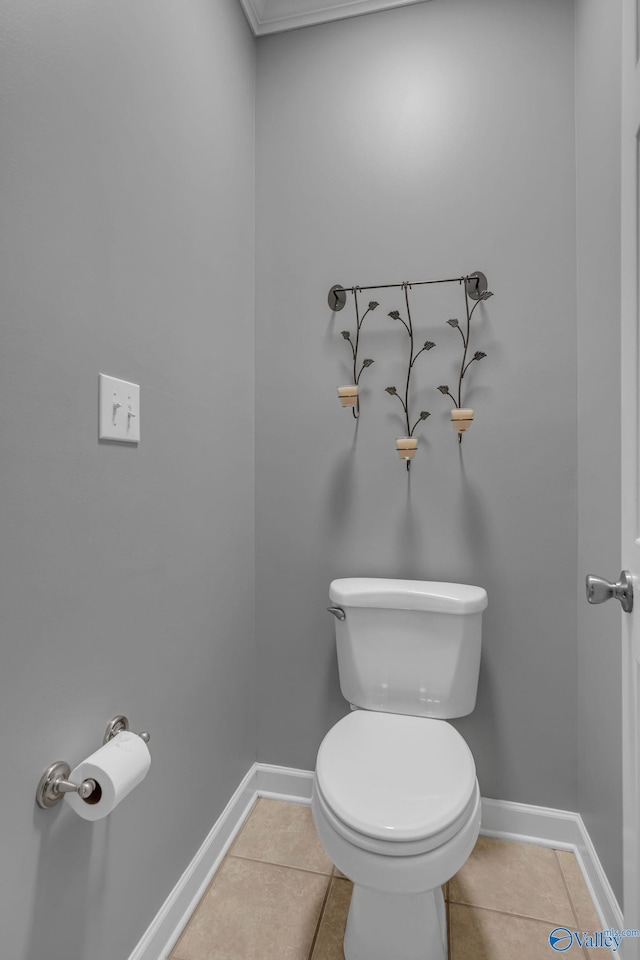 bathroom with tile patterned flooring and toilet