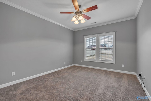 carpeted spare room with ceiling fan and crown molding