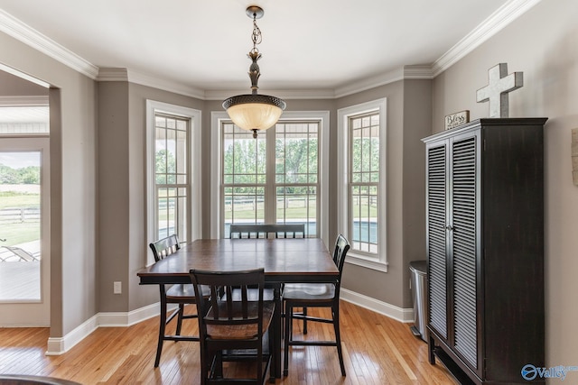 14690 Birchbark St, Athens, AL 35613 - dining room featuring light wood-style floors, baseboards, and crown molding