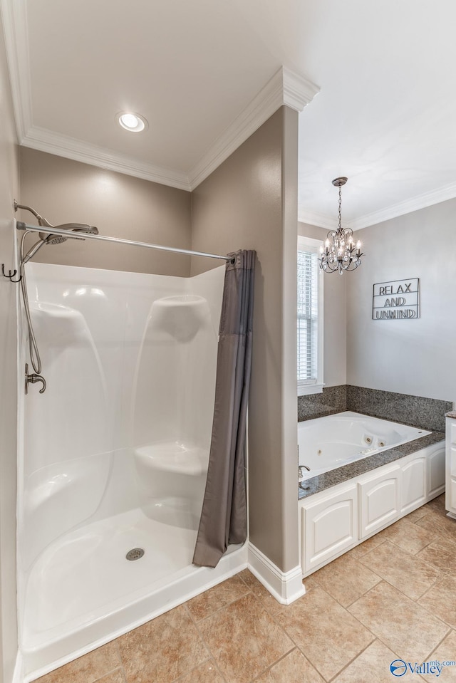 14690 Birchbark St, Athens, AL 35613 - bathroom featuring a notable chandelier, a tub with jets, ornamental molding, and a stall shower