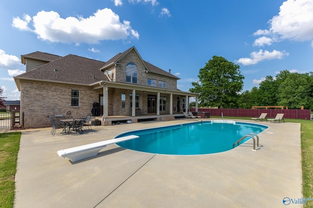 14690 Birchbark St, Athens, AL 35613 - view of swimming pool with a patio, a fenced in pool, a fenced backyard, and a diving board