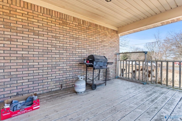 wooden terrace featuring grilling area