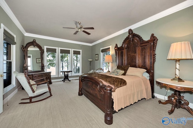 carpeted bedroom with crown molding and ceiling fan