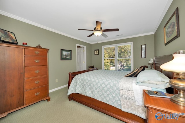 bedroom with carpet floors, ornamental molding, and ceiling fan