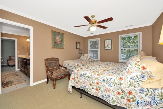 bedroom featuring ornamental molding, ceiling fan, ensuite bathroom, and light carpet