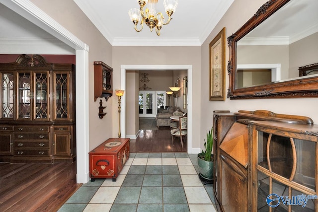 hall featuring hardwood / wood-style flooring, a chandelier, and ornamental molding