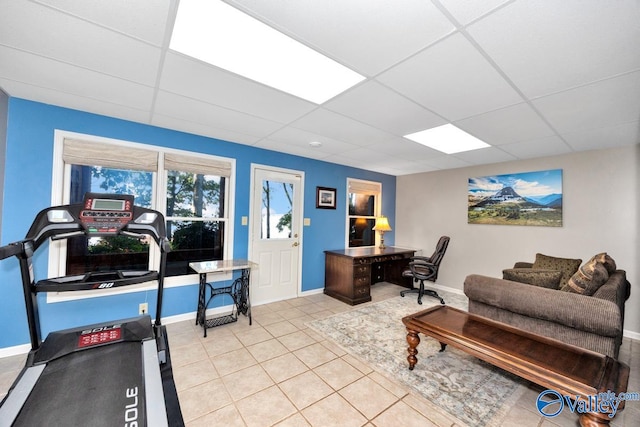 tiled home office with a drop ceiling