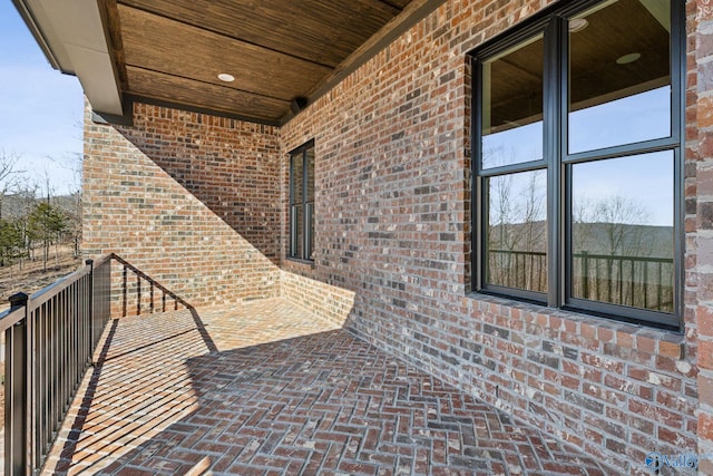 view of patio featuring a balcony