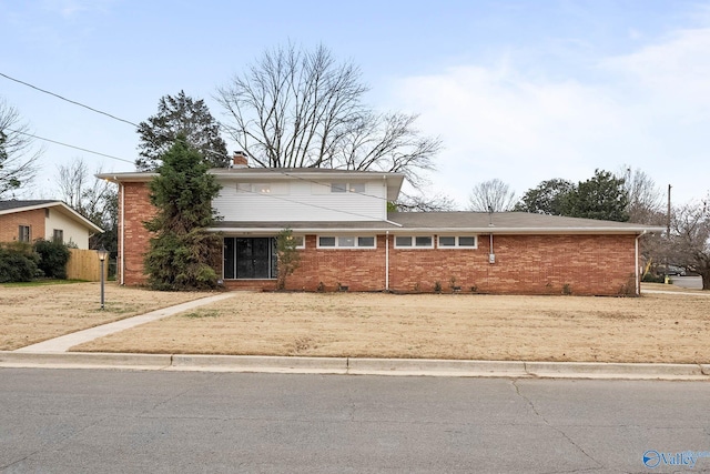 traditional-style home featuring brick siding