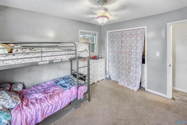 bedroom with ceiling fan and carpet floors