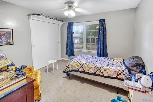 carpeted bedroom featuring ceiling fan