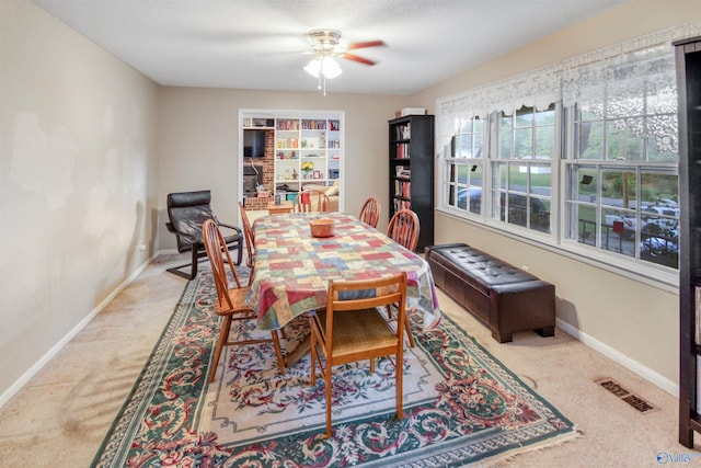 dining room featuring carpet and ceiling fan