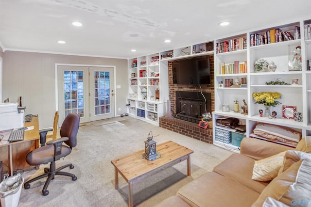 living room featuring crown molding, light carpet, a fireplace, and wood walls