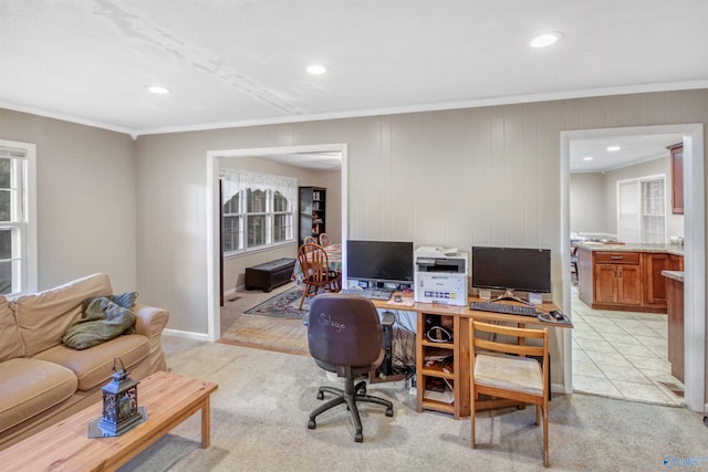 carpeted office with crown molding and wooden walls