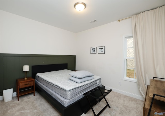 carpeted bedroom featuring multiple windows