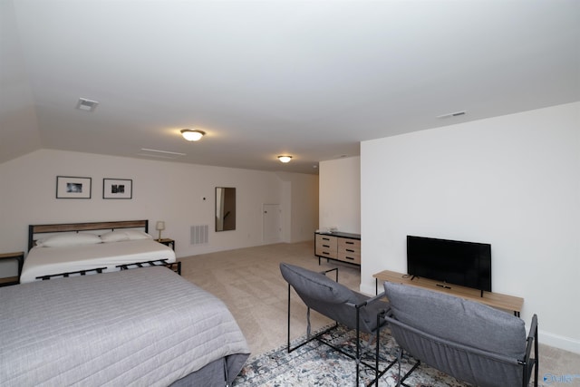 bedroom with light colored carpet