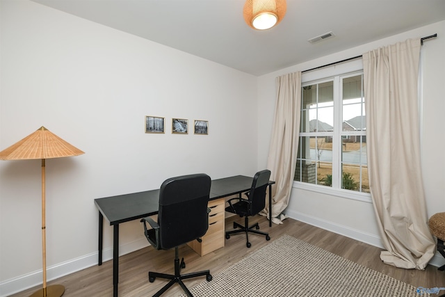 office with wood-type flooring