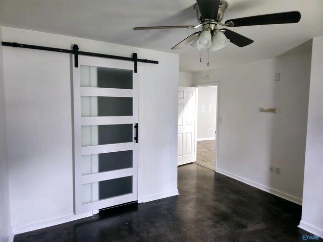 67 Forest Chapel Rd, Hartselle, AL 35640 - unfurnished bedroom with a barn door, concrete flooring, and ceiling fan
