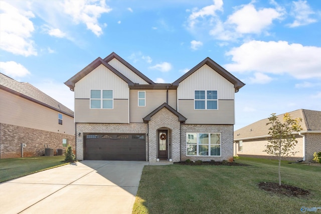 238 Cherry Laurel Dr, Hazel Green, AL 35750 - view of front of property with brick siding, driveway, a front lawn, and a garage