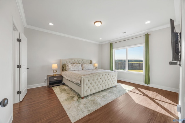 bedroom featuring ornamental molding and dark hardwood / wood-style flooring