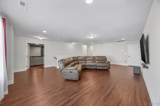 living room featuring dark wood-type flooring