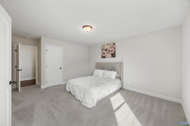 bedroom featuring light colored carpet