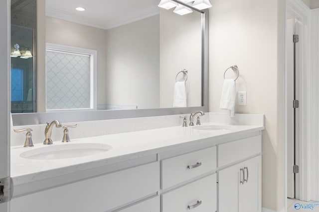 full bath with double vanity, recessed lighting, a sink, and crown molding