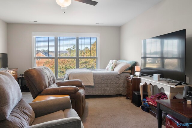 bedroom featuring light carpet and visible vents