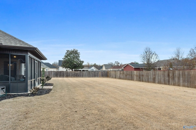 view of yard featuring a sunroom