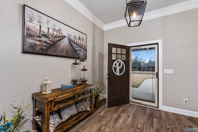 foyer entrance featuring hardwood / wood-style floors and ornamental molding