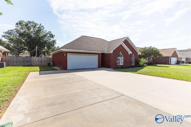 view of front facade featuring central AC unit, a garage, and a front lawn