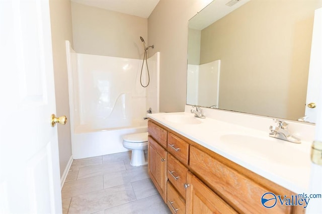 full bathroom featuring vanity, tile patterned flooring, toilet, and shower / bathtub combination