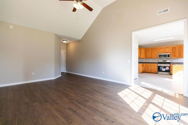 unfurnished living room with lofted ceiling, ceiling fan, and light hardwood / wood-style flooring