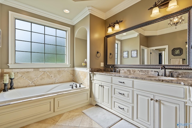 bathroom with a sink, ornamental molding, a garden tub, and double vanity