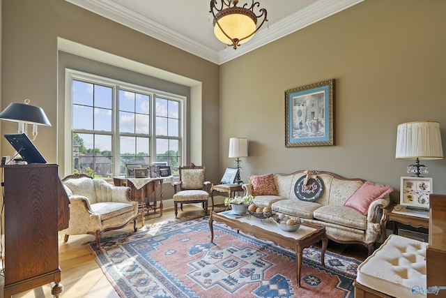 living room with ornamental molding and wood finished floors