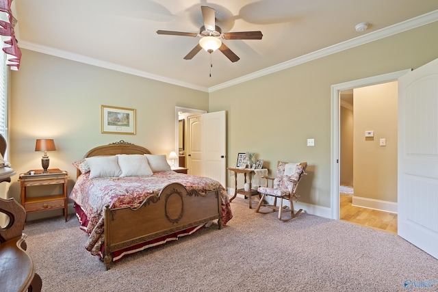 bedroom with crown molding, baseboards, light carpet, and ceiling fan
