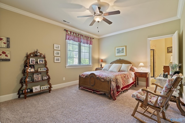 carpeted bedroom with visible vents, ornamental molding, baseboards, and a ceiling fan