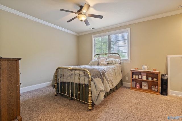 bedroom with carpet floors, baseboards, and crown molding