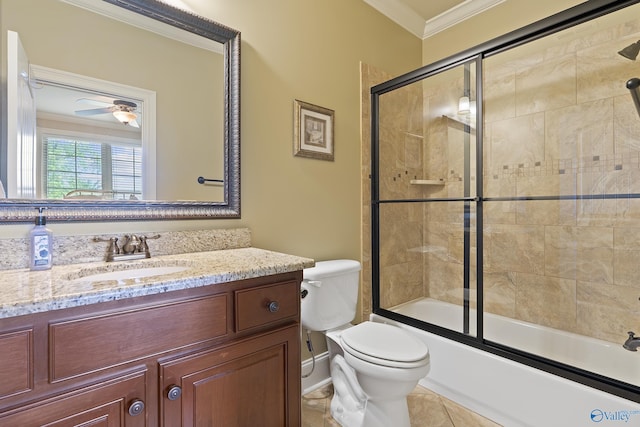 bathroom featuring vanity, ornamental molding, toilet, ceiling fan, and bath / shower combo with glass door