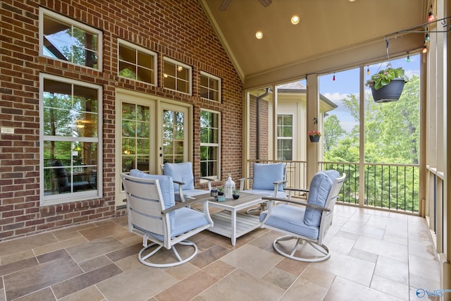 sunroom / solarium featuring french doors