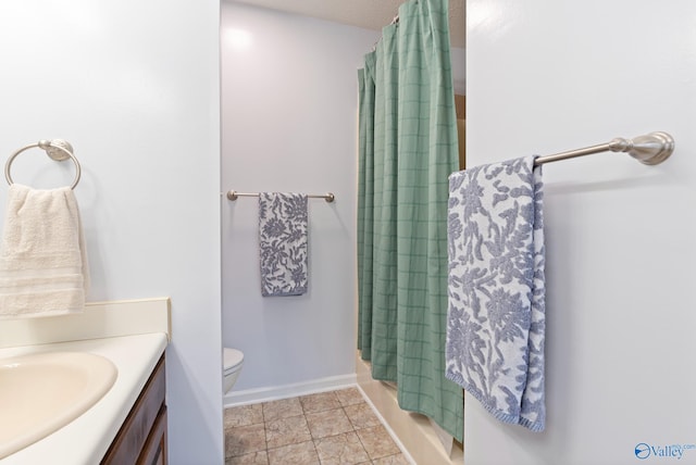 full bathroom with tile patterned flooring, shower / bath combination with curtain, vanity, and toilet