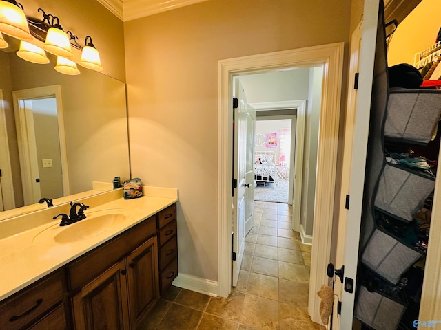 bathroom featuring vanity, tile patterned floors, and crown molding